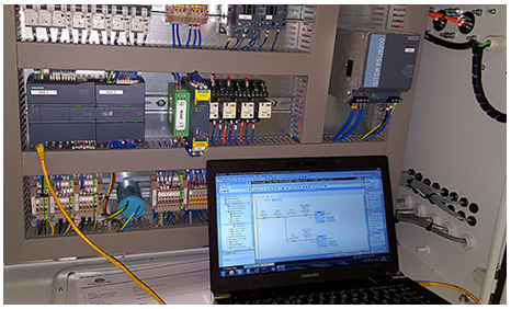 A picture containing text, indoor, computer, electronicsDescription automatically generated