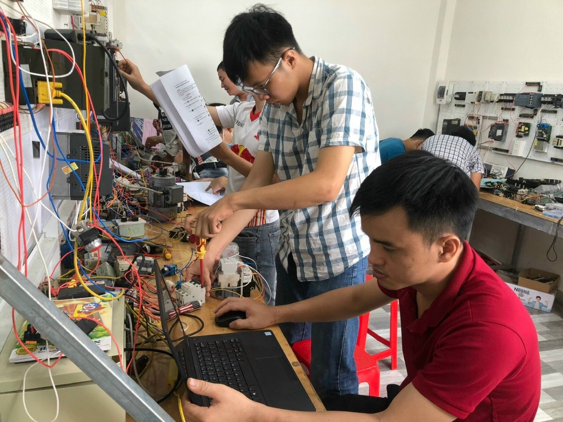 A person working on a machineDescription automatically generated with low confidence